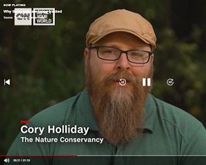 Screen grab from a video showing Cory Holliday talking on a news program.