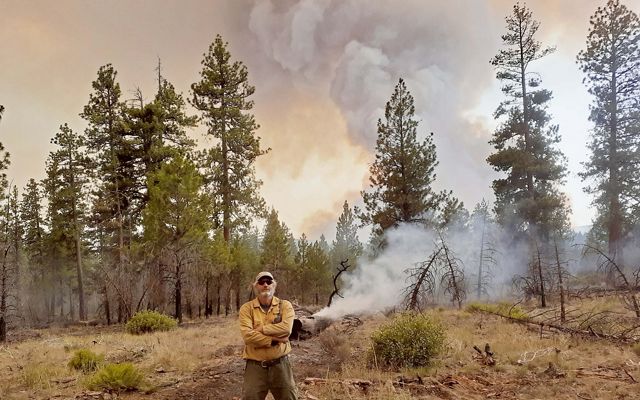 David Printiss stands on the firelines of the Bootleg Fire near Sycan Marsh Preserve in Oregon. 