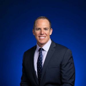 Professional headshot of David Tuthill, Florida trustee.