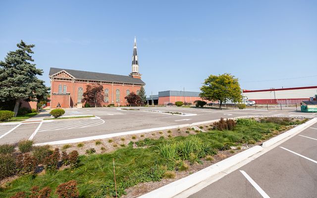 Photo of the parking lot at Sacred Heart Church, where stormwater infrastructure is helping to keep rainwater runoff from polluting nearby waters.