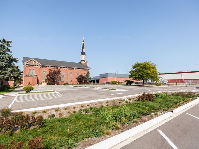 Photo of the parking lot at Sacred Heart Church, where stormwater infrastructure is helping to keep rainwater runoff from polluting nearby waters.