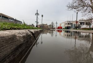 Storm water backs up after a heavy rain.