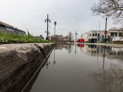 Storm water backs up after a heavy rain.
