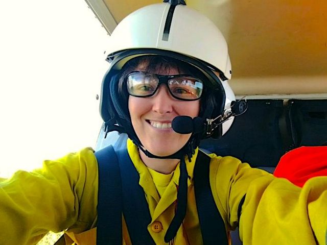 Nikole Simmons snaps a selfie from the cockpit of a helicopter during aerial ignition of a controlled burn at Piney Grove Preserve in 2017.