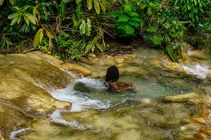 A woman relaxing in the water.