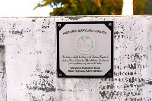 A sign on a bride reads "Historic Maryland Bridge".