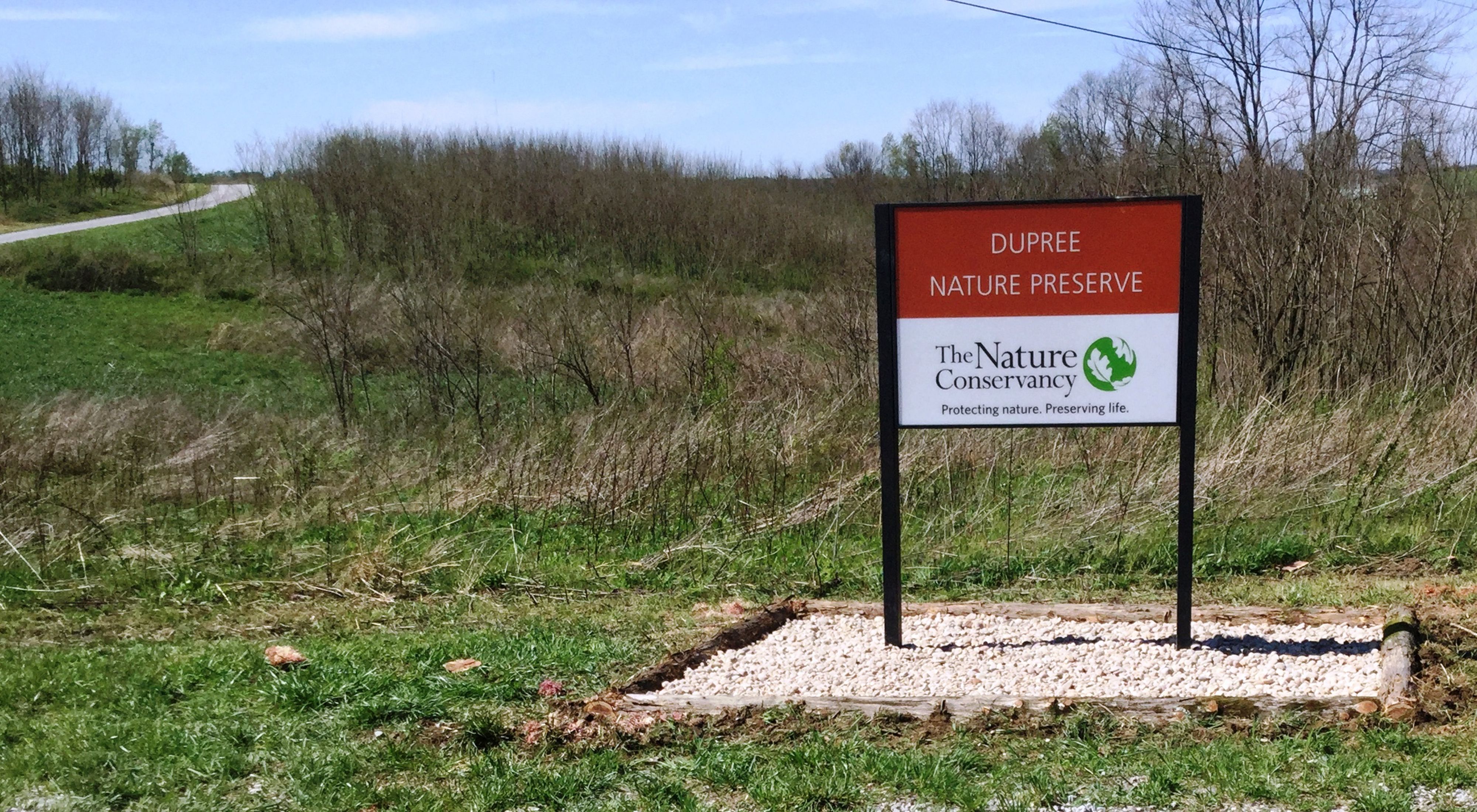 A brown and white sign marks a Dupree Nature Preserve.