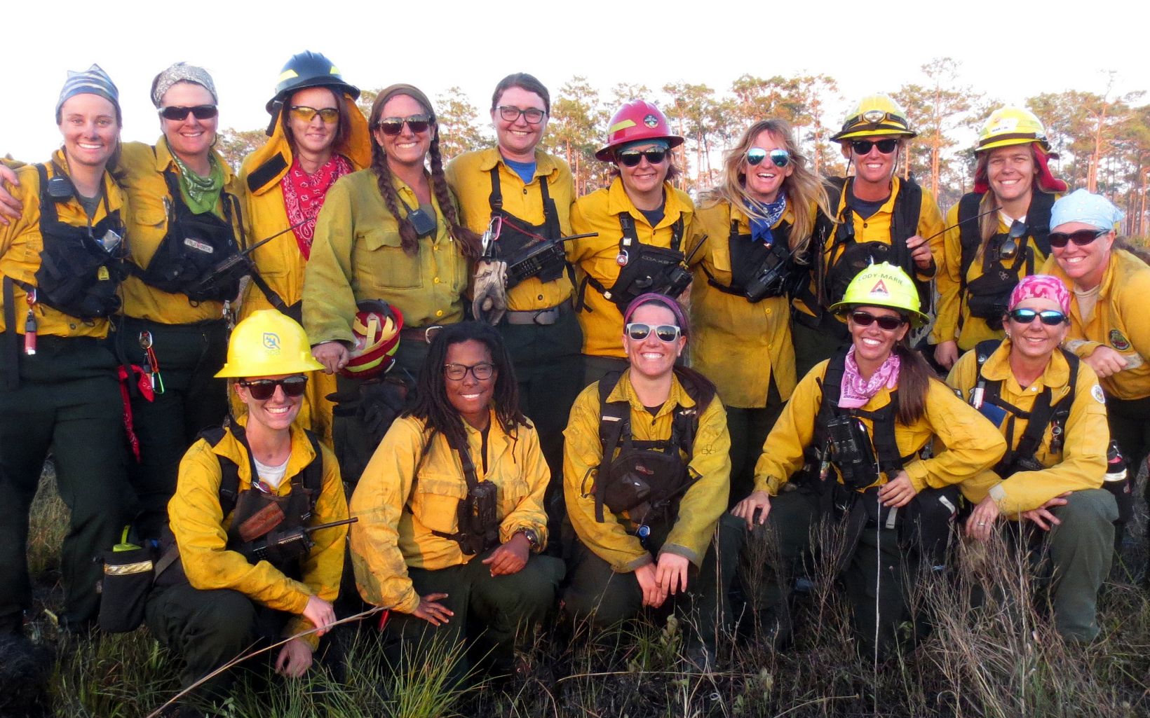 Fifteen women wildland firefighters during an all-female controlled burn at Disney Wilderness Preserve.