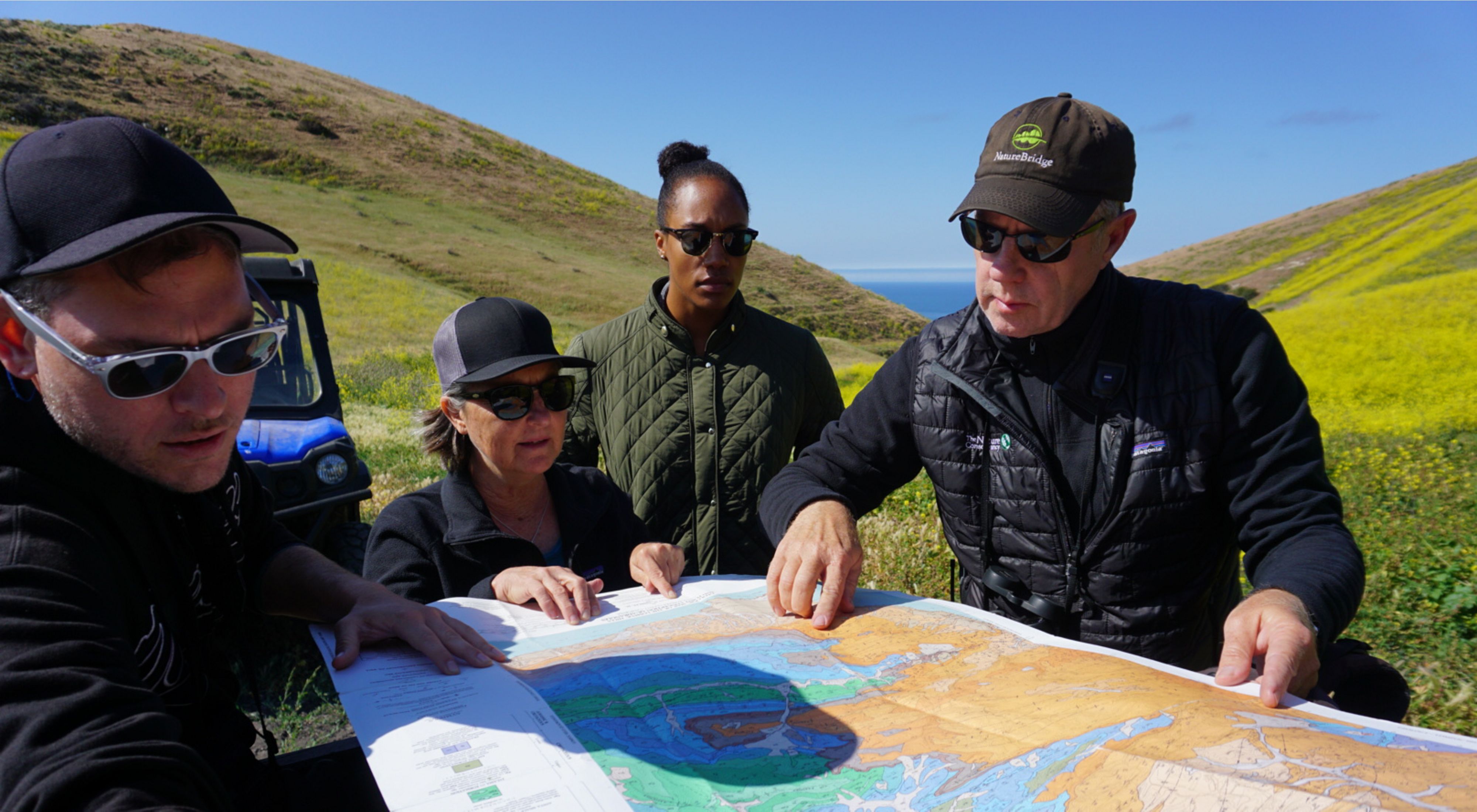 TNC scientists review a map at Dangermond Preserve.