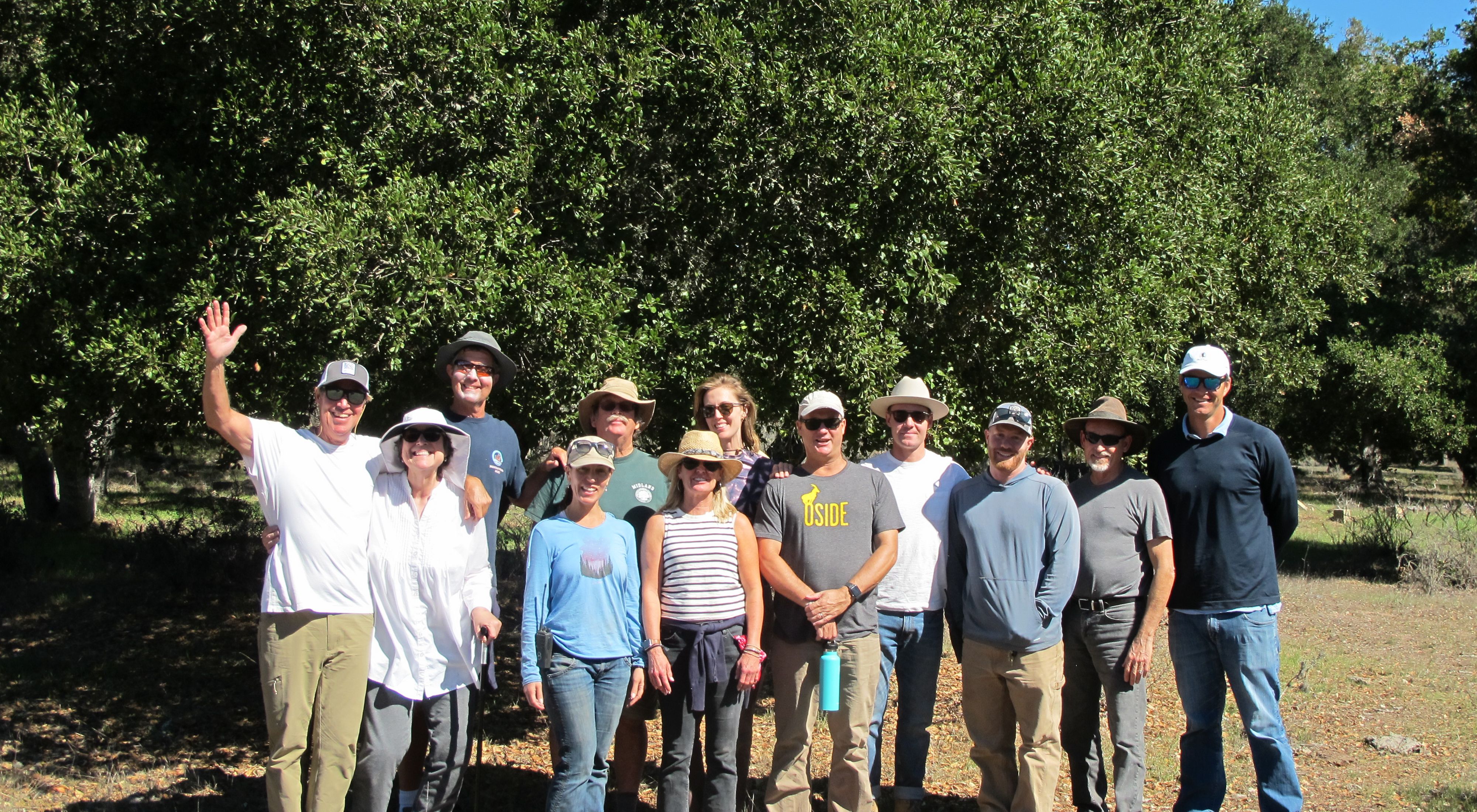 Photo of volunteers posing together during an exciting day performing conservation work at TNC's Jack and Laura Dangermond Preserve. 