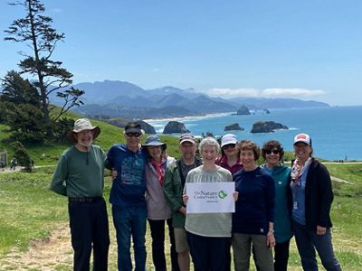 TNC travelers and staff after a hike on the Oregon coast.