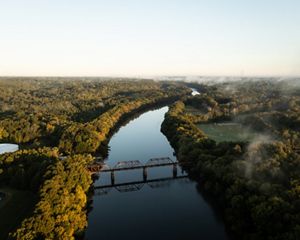 Aerial view a river with a bridge the Cape Fear River at sunset.