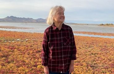 Ella Sorensen standing on a wetlands preserve.