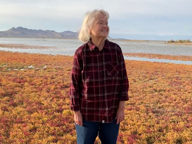 Ella Sorensen stands near the bank of the Great Salt Lake.