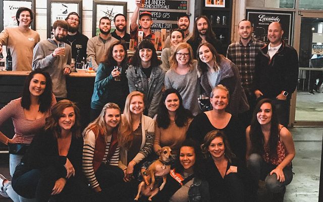 A group of smiling staff from Eventide Brewing in Georgia.