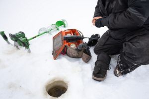 A hole forms in a frozen body of water
