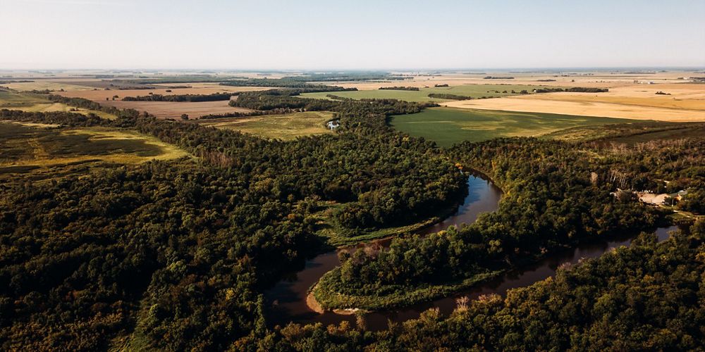 High-altitude view of a Canadian landscape with a mix of fields and forest.