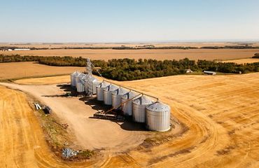 Grain silos in a field.