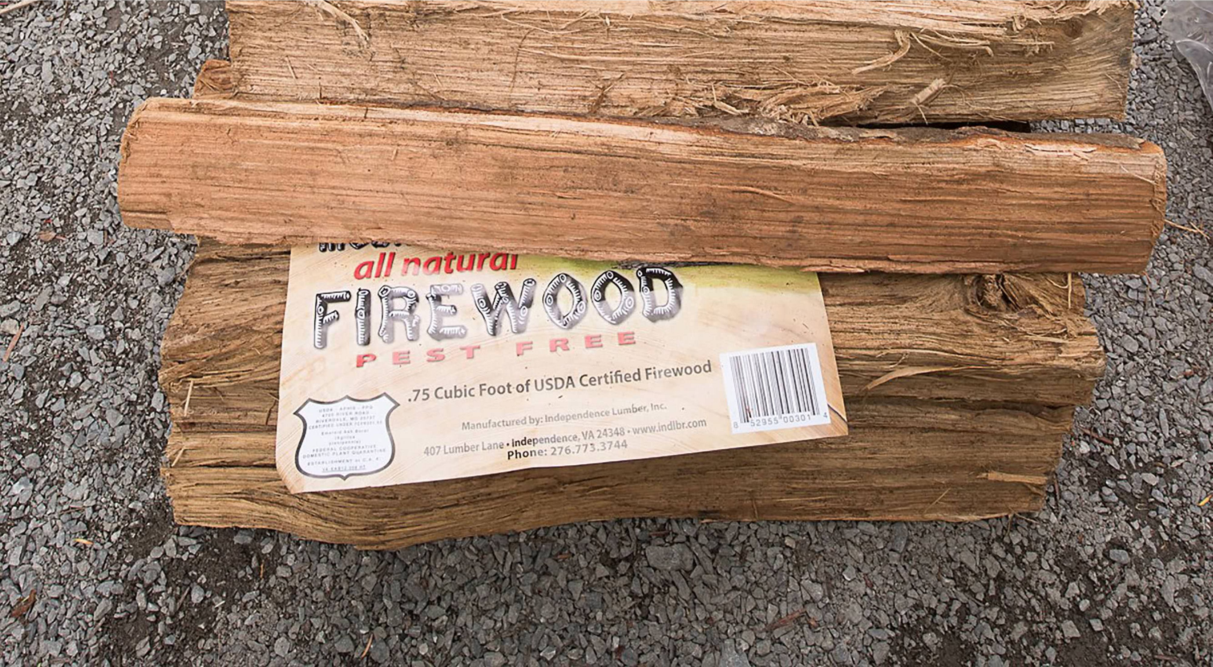 A pile of heat-treated firewood awaits purchase.