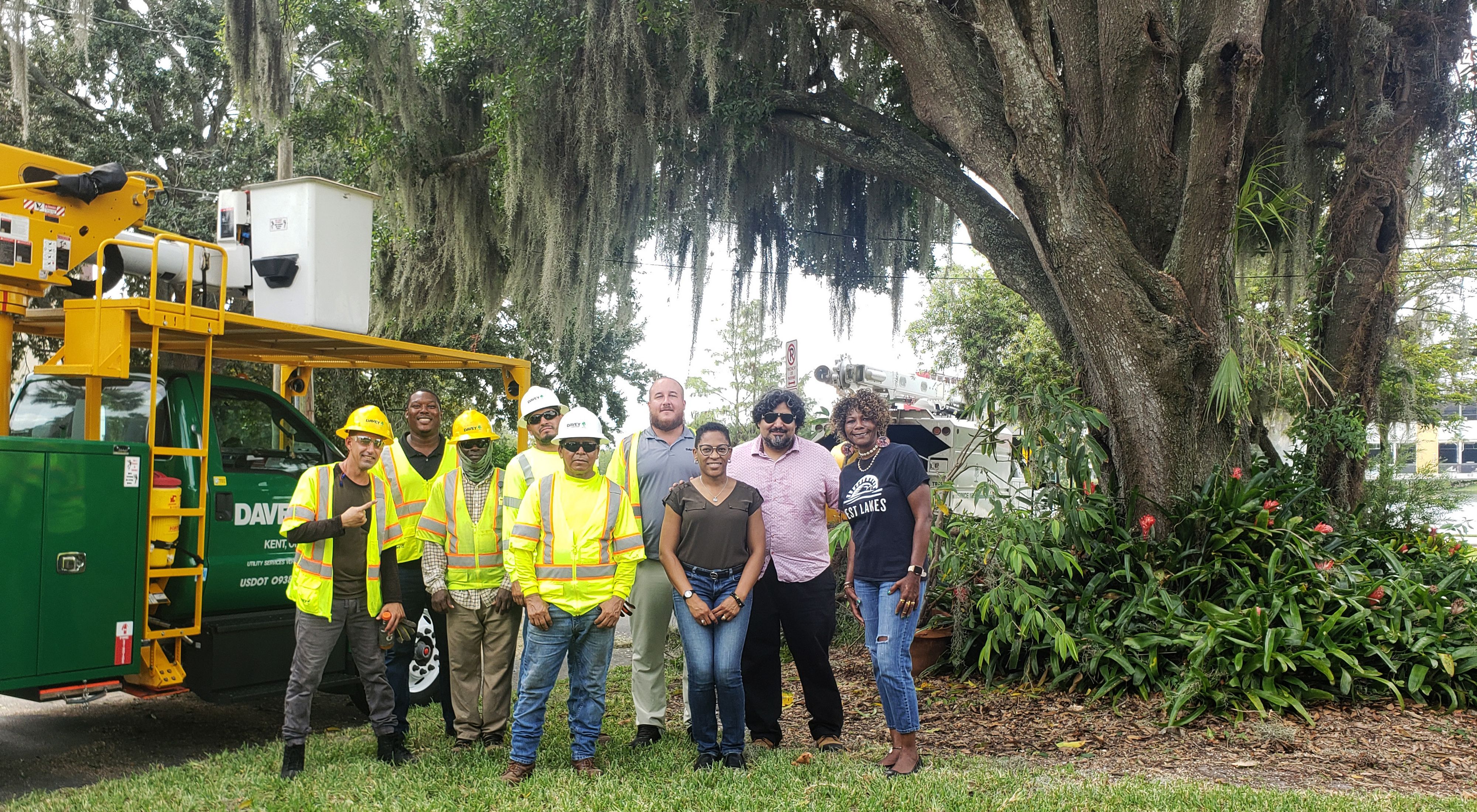 TNC and partners stand next to a tree pruning truck in Orlando, Florida.