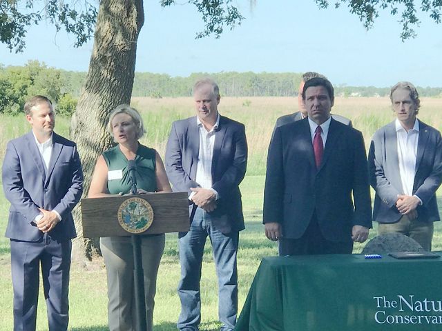 Temperince Morgan speaking at the ceremonial signing of the Florida Wildlife Corridor Act at Disney Wilderness Preserve. 