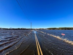 A road impassible with flooded water.