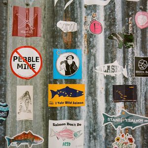 stickers on metal. Ex: a line through "Pebble Mine"