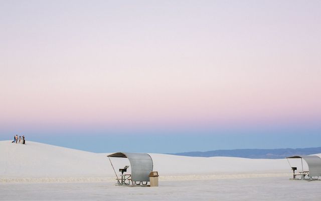 Picnic shelters at dusk at White Sands National Park, New Mexico.