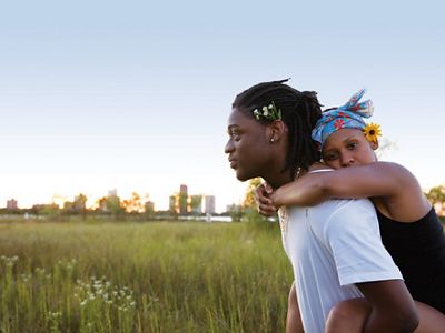 Veasna Johnson and Anthony Okocha celebrate the first day of summer with a picnic at Chicago’s Montrose Beach Dunes, Illinois.