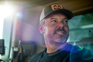 A man wears a baseball cap