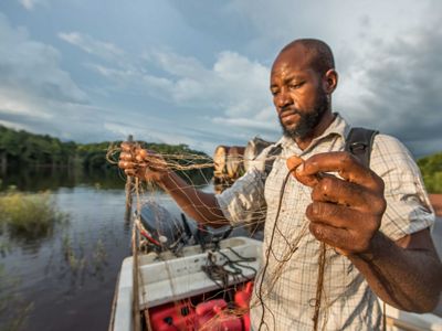 Man inspects fishing net