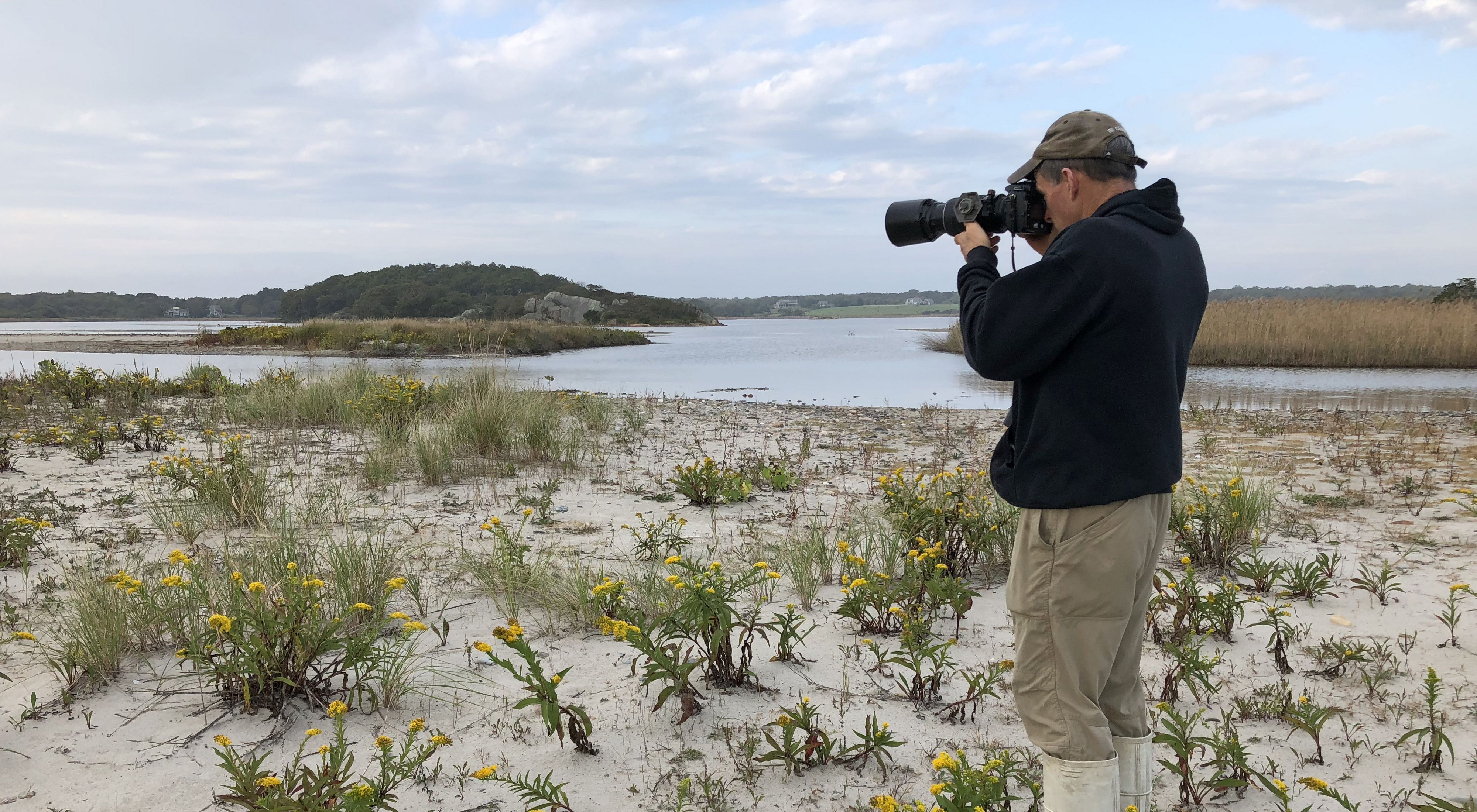 Photographer photographing shorelines of Rhode Island.