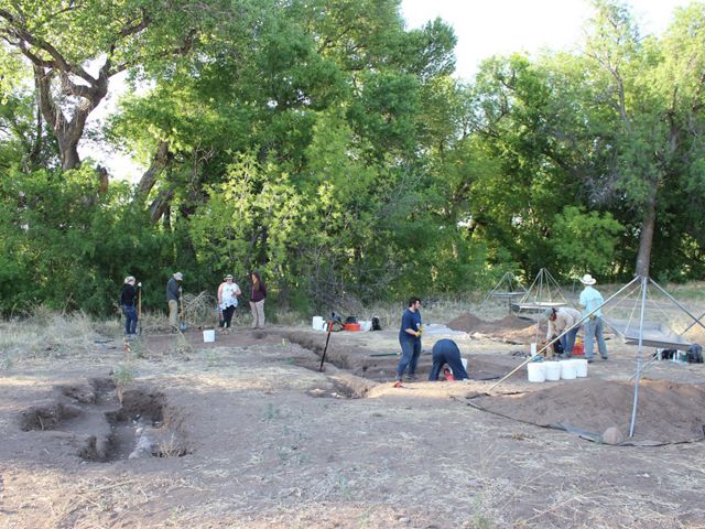 Several people on an archaelogical dig.