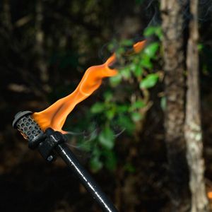 A lit drip torch is ready for use during a controlled burn in South Carolina.