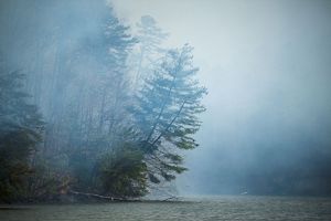 Smoke drifts over the North Saluda Reservoir.