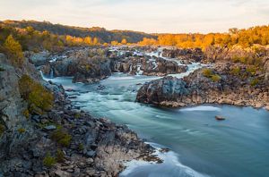 The Potomac River falls over the rocky outcrops at Great Falls before smoothly flowing into the channel.