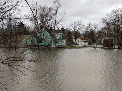 Homes are flooded on a rainy day in Green Bay, Wisconsin.