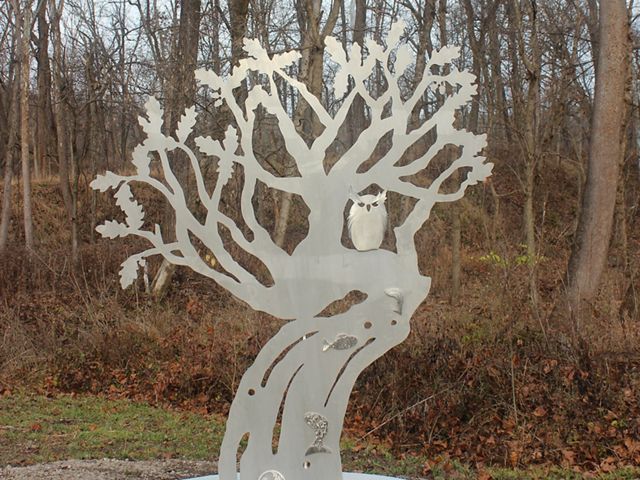 a metal sculpture of a tree