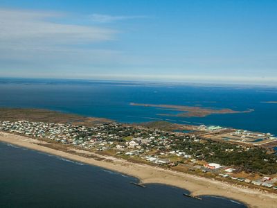 An aerial view of the Grand Isle in Louisiana under a bright blue sky.