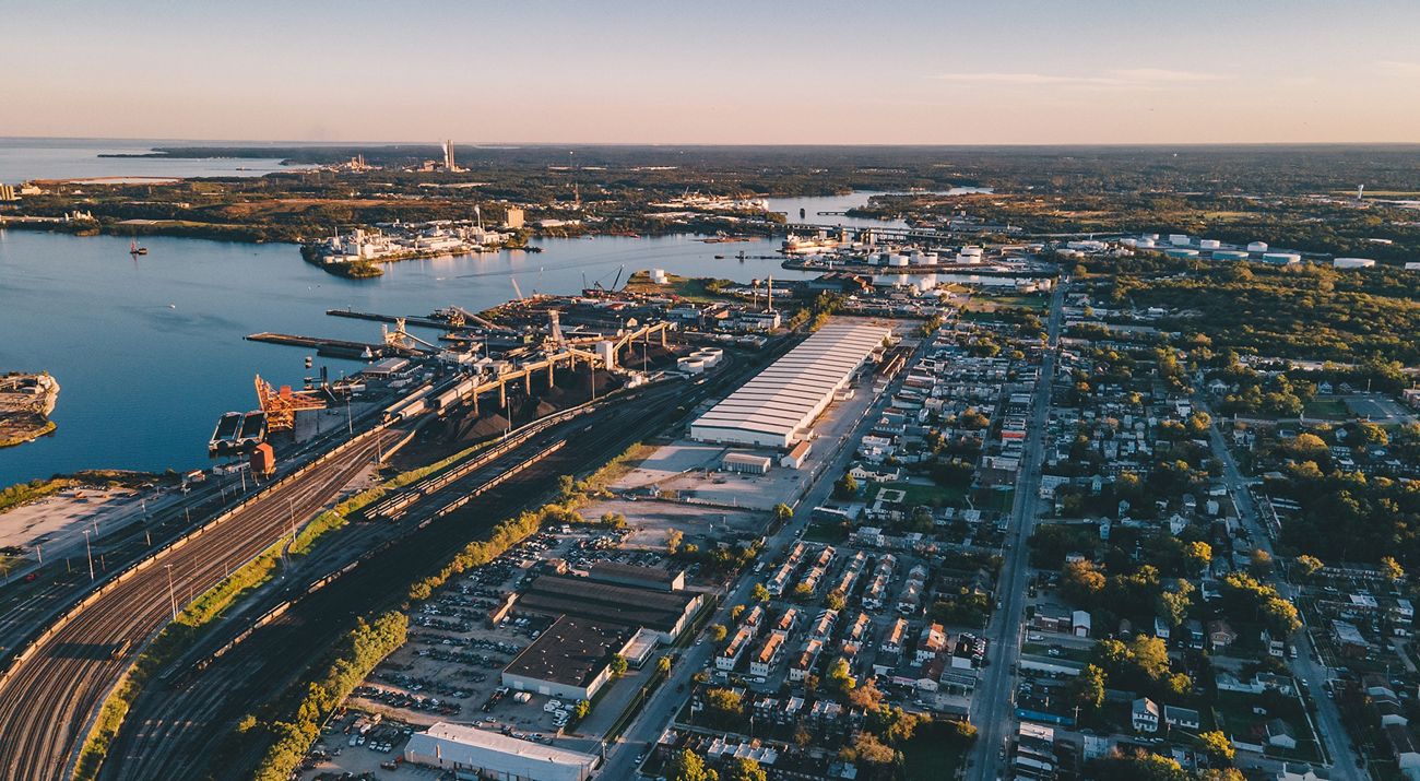 Aerial view of an industrial urban area alongside a bay.