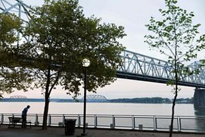 Bridges crossing over a wide river.