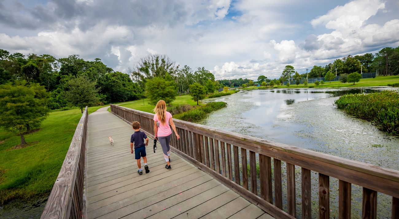 Mother and child walk along Lake Lawne Florida