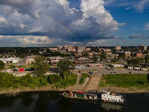 Rainbow over buildings in an urban setting.