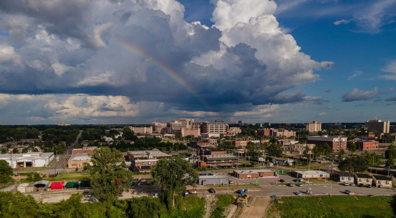 Rainbow over buildings in an urban setting.