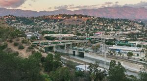 A view of urban Los Angeles, the Los Angeles River and San Gabriel Mountains.