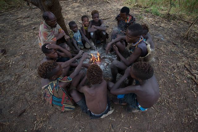 At sundown, members of the Hadza tribe come together to build a fire and share stories from the day.
