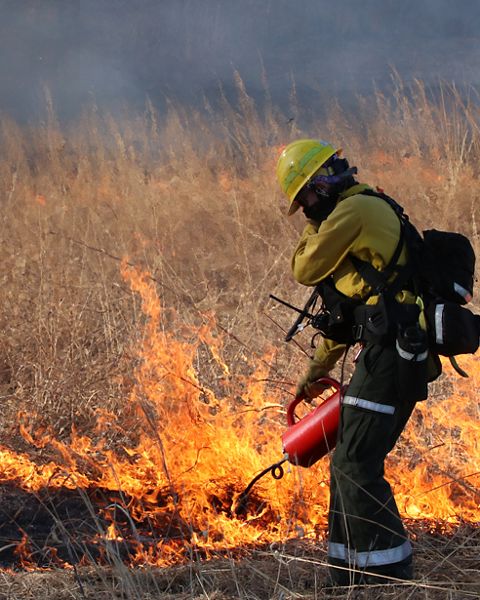 Hannah Spaul, TNC Wisconsin's Director of Conservation Land Management, helps out with a prescribed fire at TNC's Spring Green Prairie Preserve. 