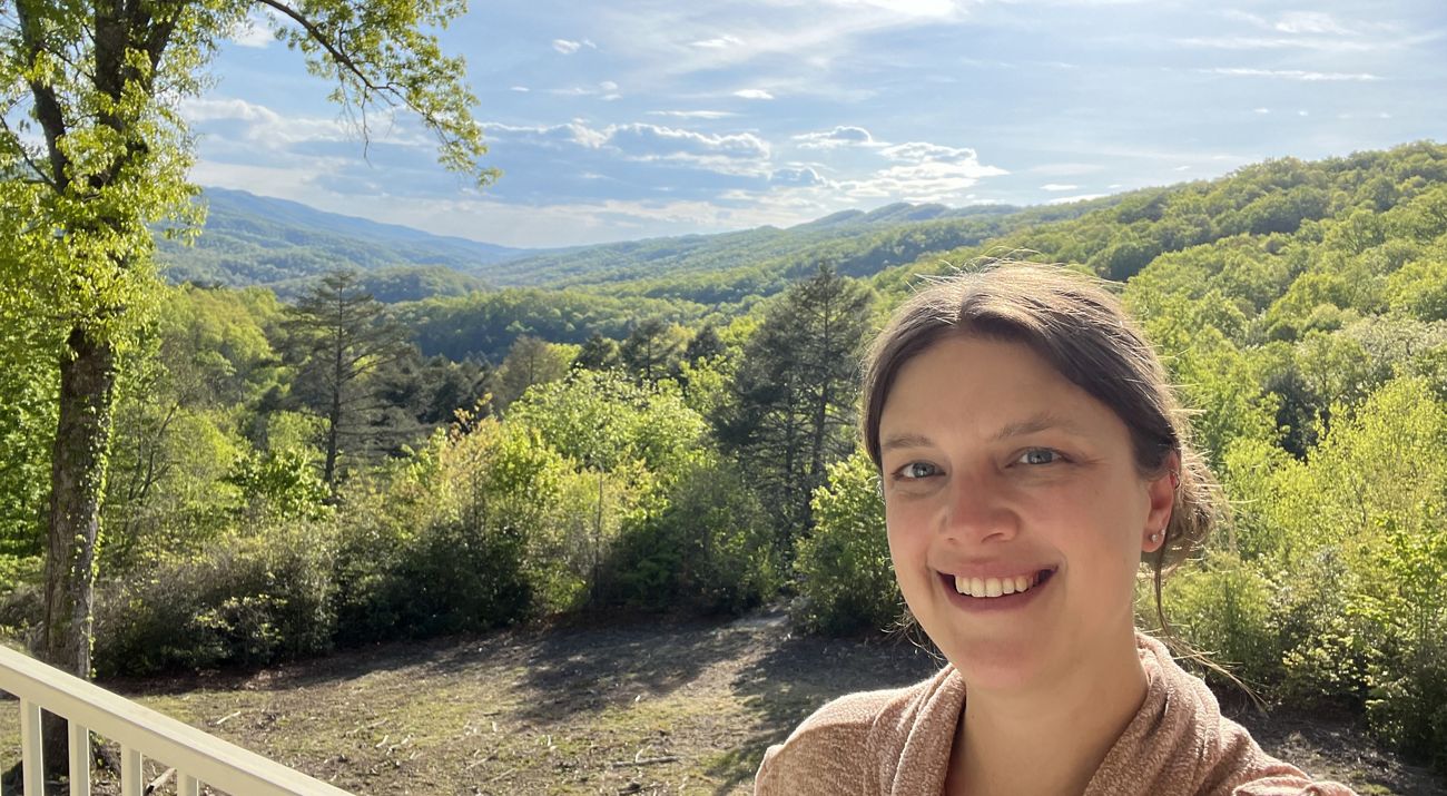 Heather Jeffs stands in front of a sweeping Kentucky valley landscape in Pine Mountains.