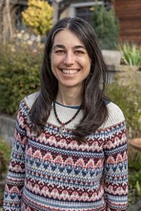 A woman smiling at the camera. 