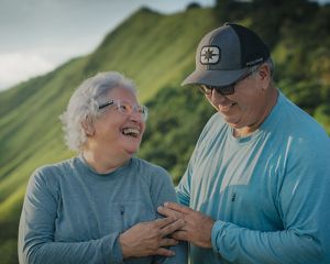 Two people smiling at each other.